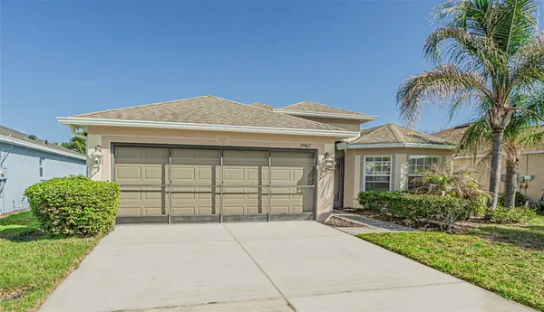 front view of a house with a garden
