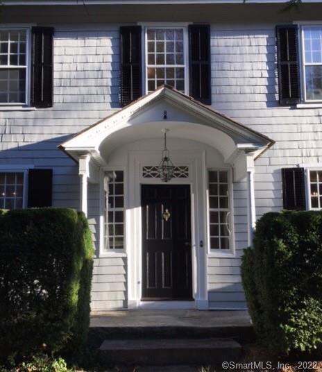 422 Ridgefield Road Wilton, CT 06897 - Photo 1 of 1 a view of a house with brick walls and windows