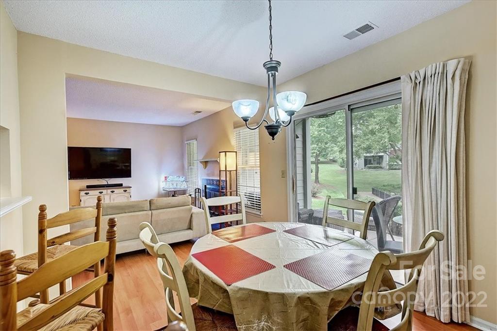 19843 Henderson Road, Unit B Cornelius, NC 28031 - Photo 15 of 43 a view of a dining room with furniture window and outside view