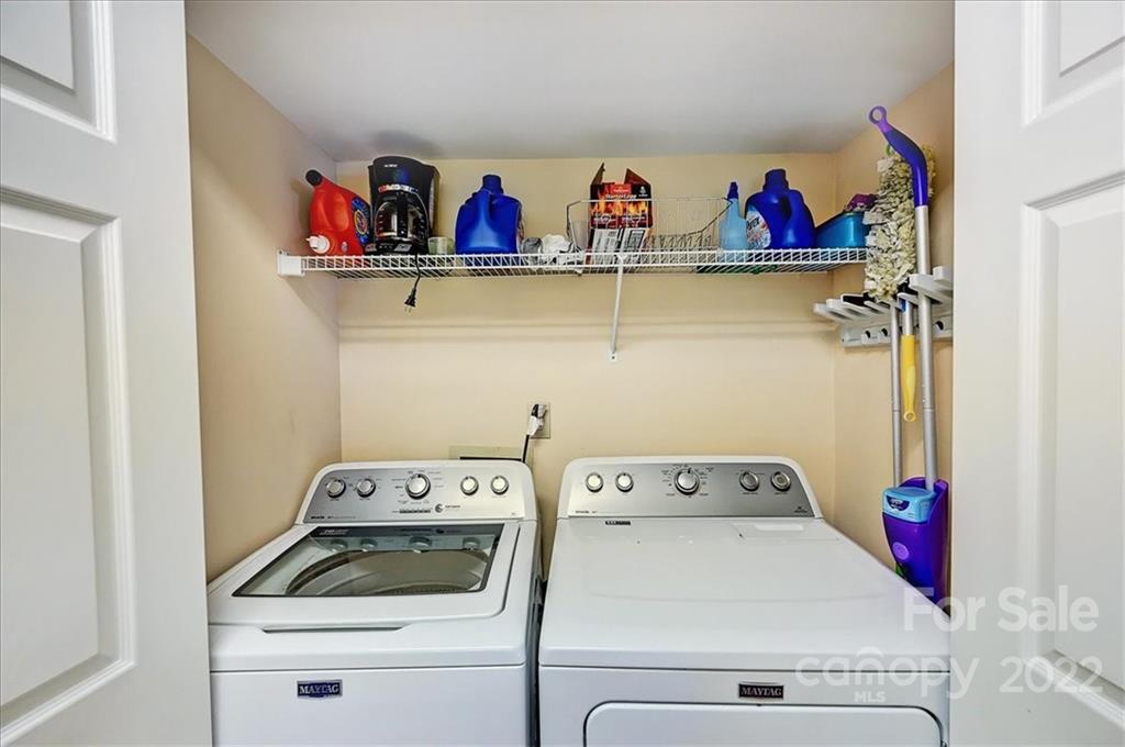 19843 Henderson Road, Unit B Cornelius, NC 28031 - Photo 27 of 43 a utility room with dryer washer and shoe rack