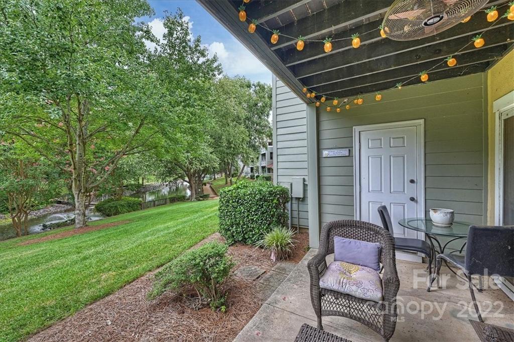 19843 Henderson Road, Unit B Cornelius, NC 28031 - Photo 28 of 43 a backyard of a house with outdoor seating