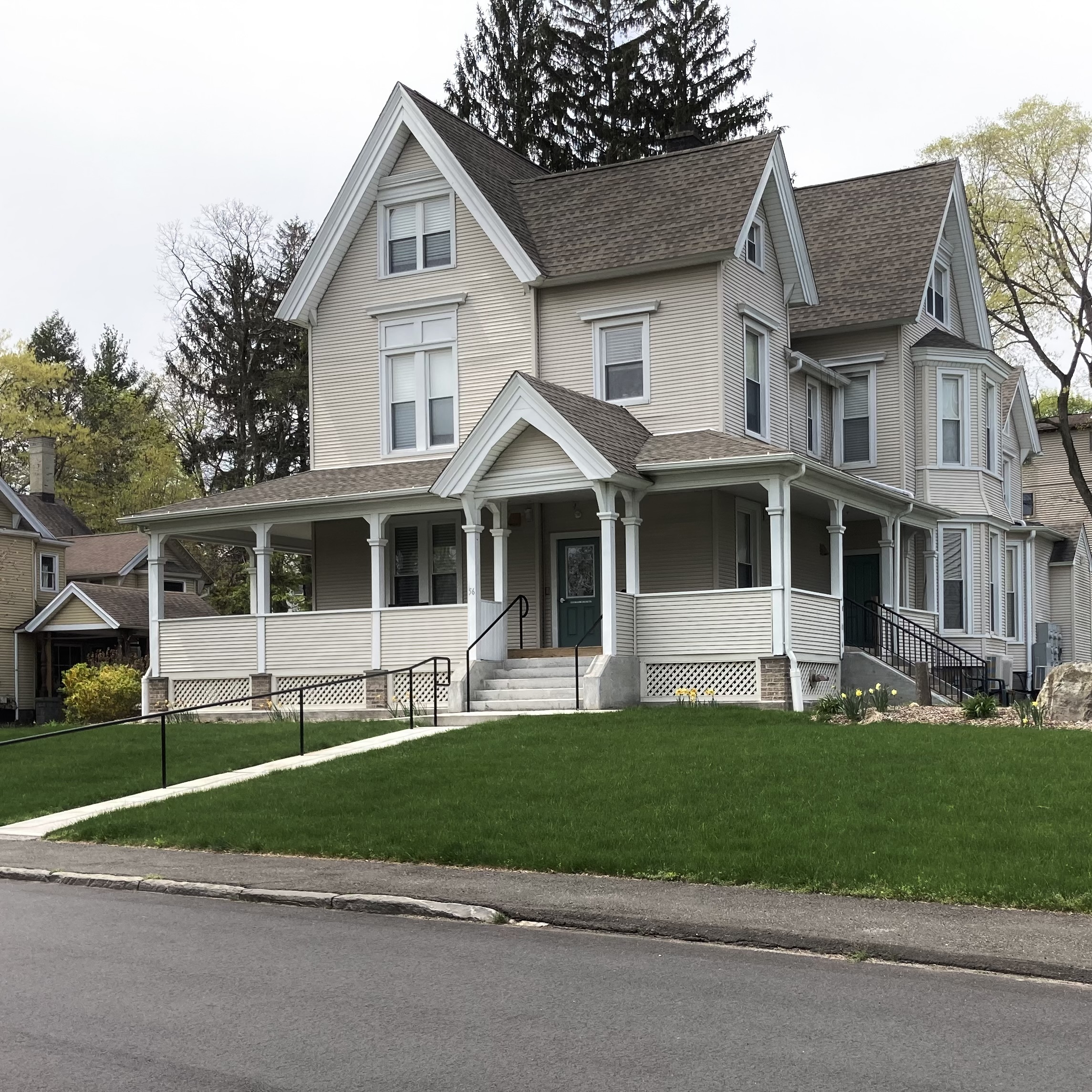 a front view of a house with a yard