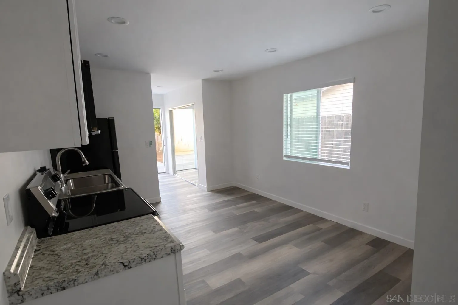 636 Aster Street Escondido, CA 92027 - Photo 2 of 8 a kitchen view with a stove and a window