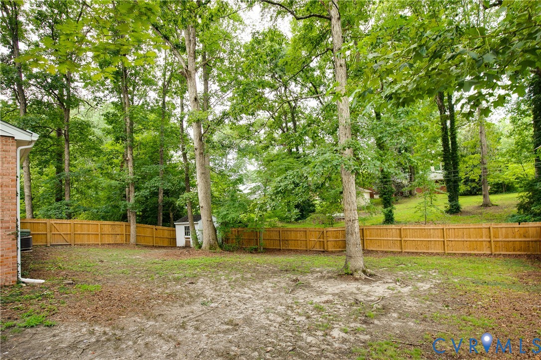 200 Stanmore Road North Chesterfield, VA 23236 - Photo 34 of 37 Expansive backyard featuring a wood privacy fence,