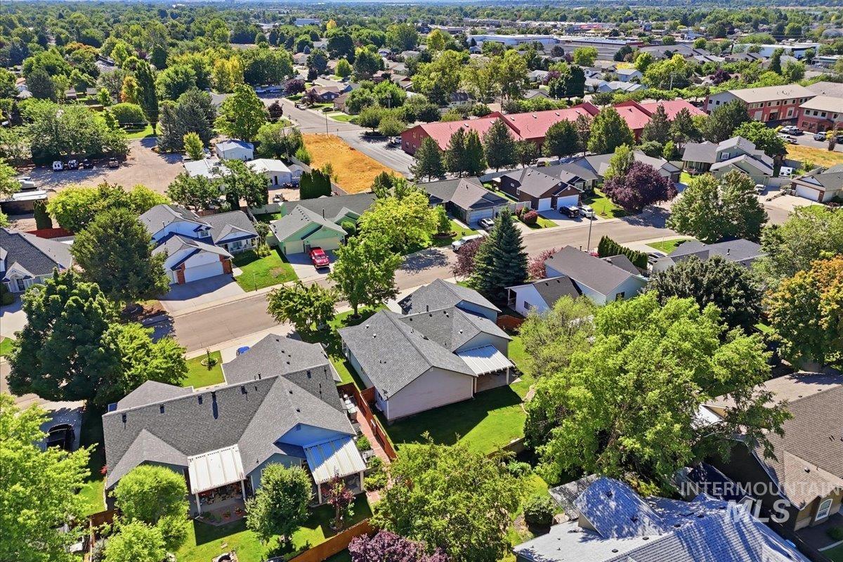 2075 North Springland Place Boise, ID 83713 - Photo 44 of 49 Aerial perspective of a residential neighborhood featuring established homes and abundant mature trees