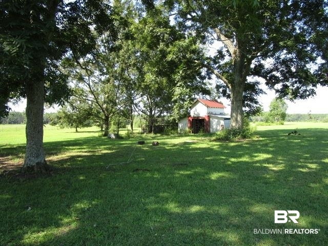 20705 Greek Cemetery Road Robertsdale, AL 36567 - Photo 21 of 25 View of grassy yard with an outdoor structure
