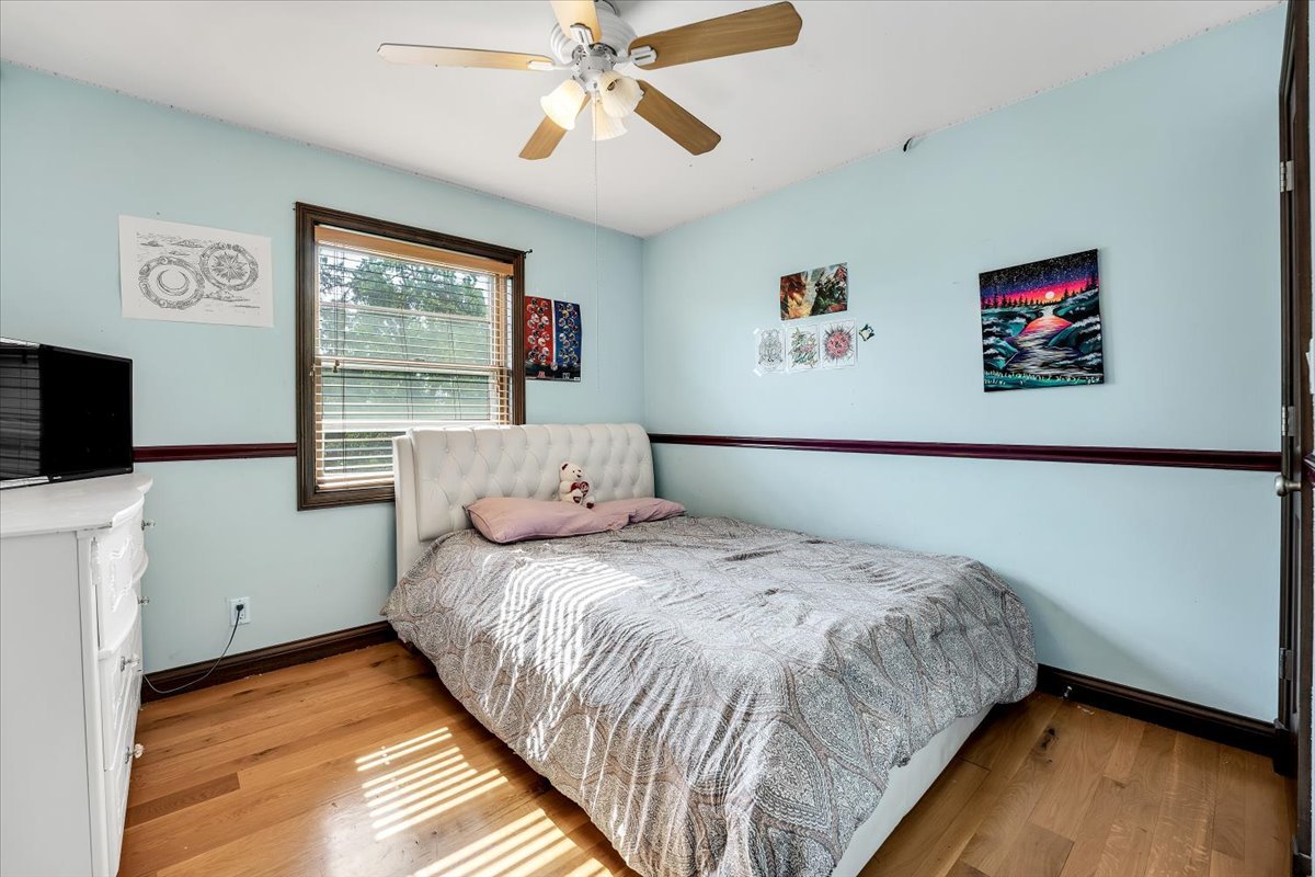 9N576 Crawford Road Elgin, IL 60124 - Photo 11 of 43 a bedroom with a bed and a flat screen tv
