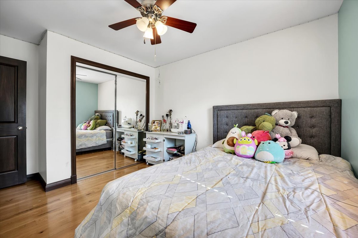 9N576 Crawford Road Elgin, IL 60124 - Photo 17 of 43 a bedroom with a bed and a chandelier