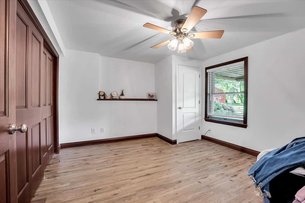 9N576 Crawford Road Elgin, IL 60124 - Photo 19 of 43 a view of an empty room with wooden floor and a window
