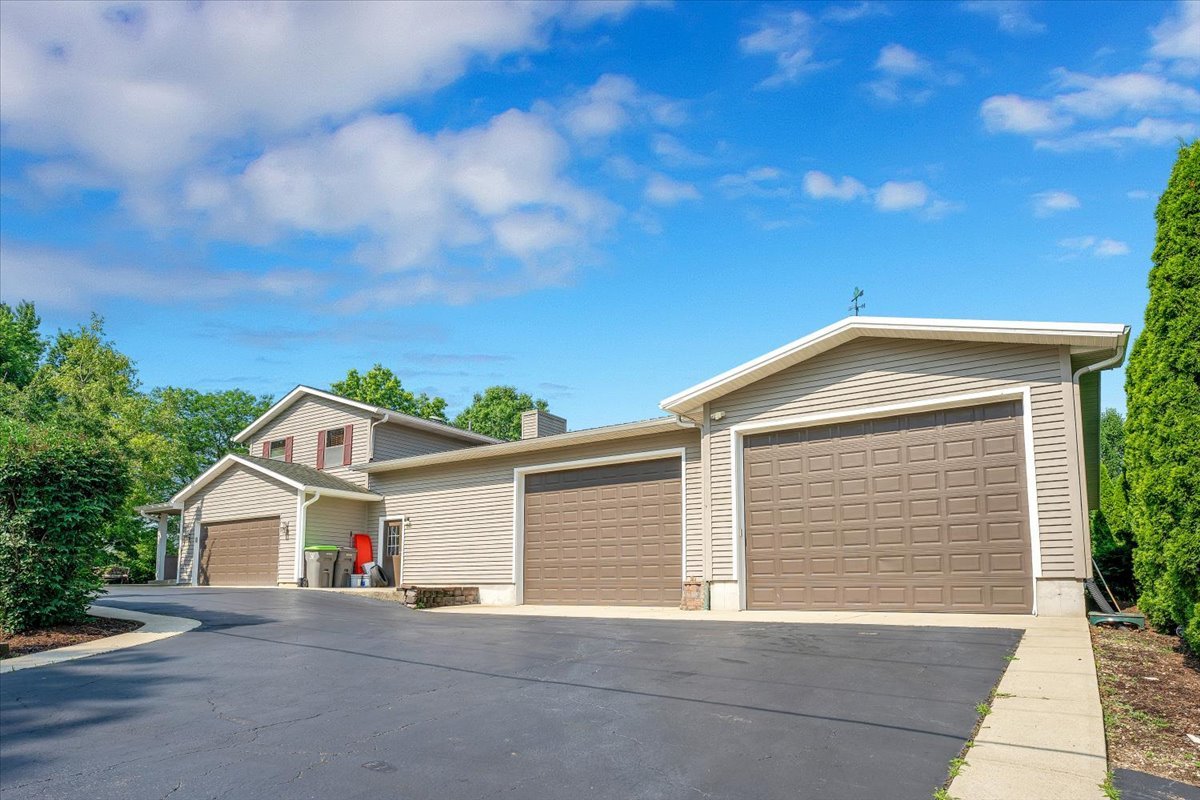 9N576 Crawford Road Elgin, IL 60124 - Photo 2 of 43 a view of the house with a garage