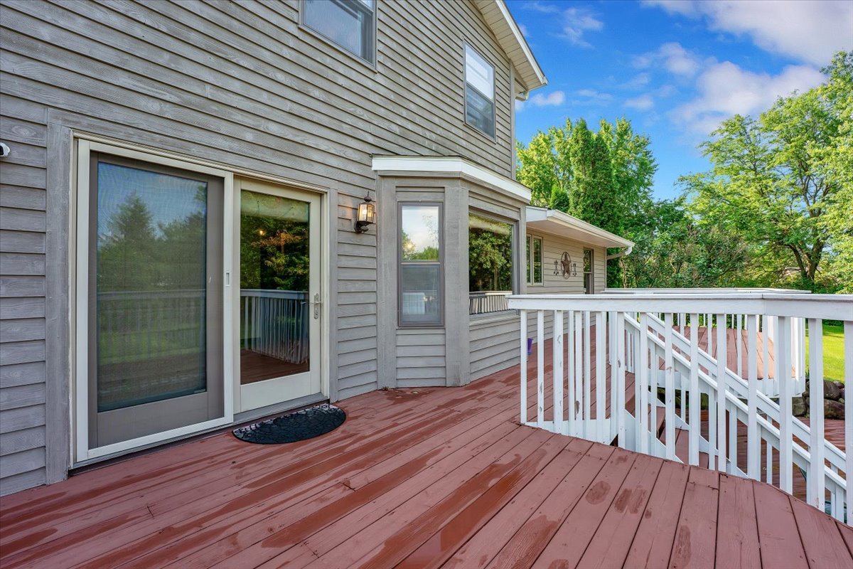 9N576 Crawford Road Elgin, IL 60124 - Photo 22 of 43 a view of a house with deck and wooden floor