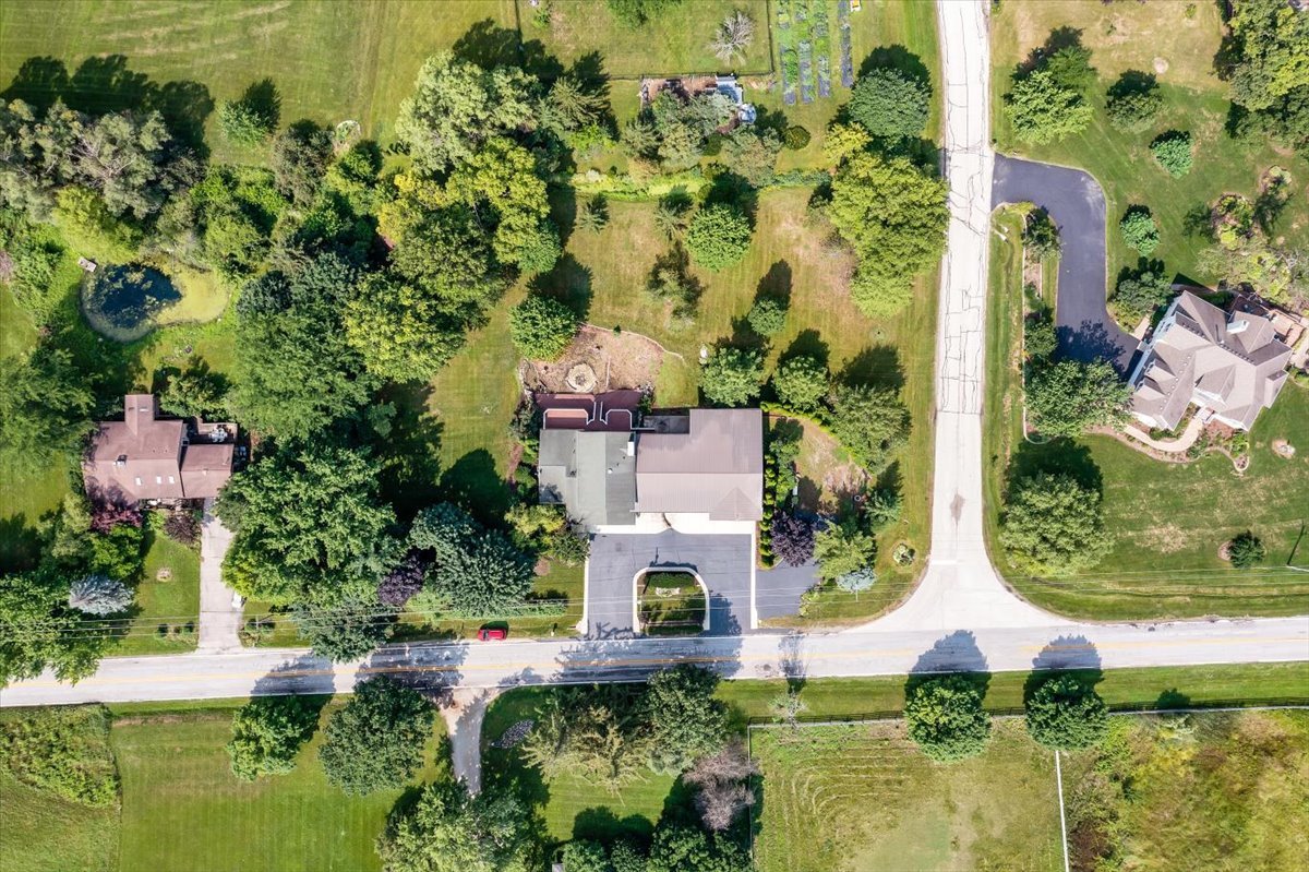 9N576 Crawford Road Elgin, IL 60124 - Photo 43 of 43 an aerial view of a house with swimming pool and garden