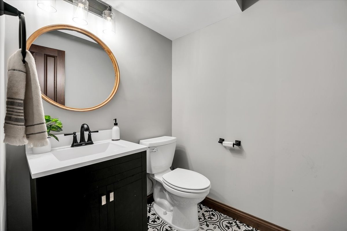 9N576 Crawford Road Elgin, IL 60124 - Photo 6 of 43 a bathroom with a sink and a mirror
