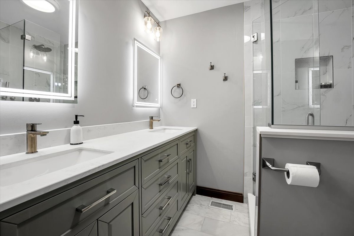 9N576 Crawford Road Elgin, IL 60124 - Photo 10 of 43 a bathroom with a double vanity sink and mirror