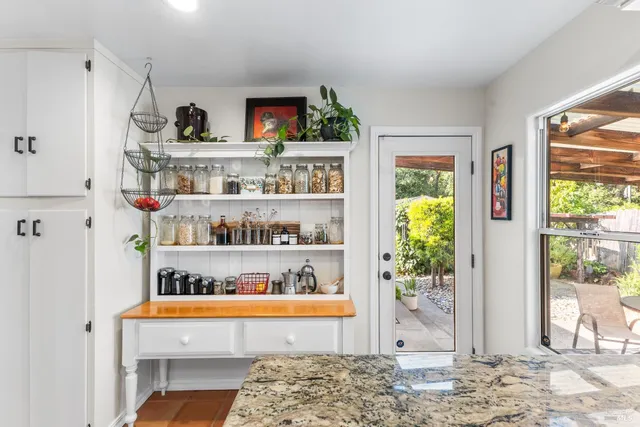 a view of cabinet with window and outdoor space