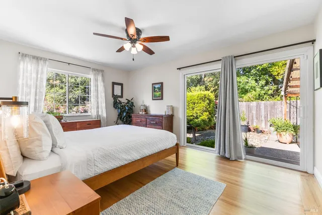 a bedroom with a large bed and a window