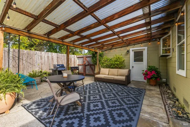 a table and chairs in front of a house