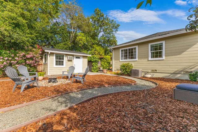 a backyard of a house with seating space