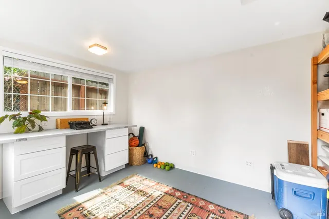 a storage room with wooden floor and furniture