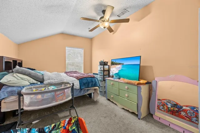 a bedroom with a bed and a dresser