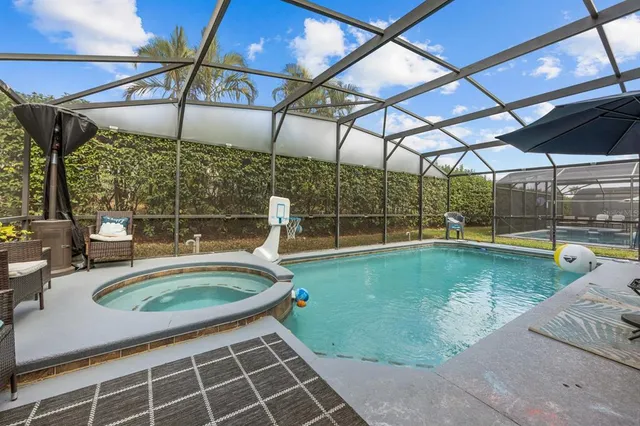 a view of a swimming pool with a patio