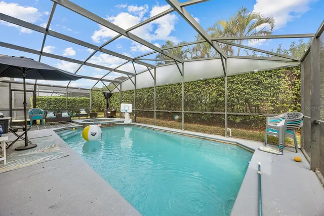 a view of swimming pool with outdoor seating