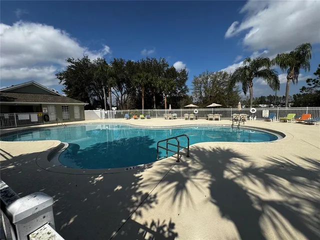 a view of a fence and trees