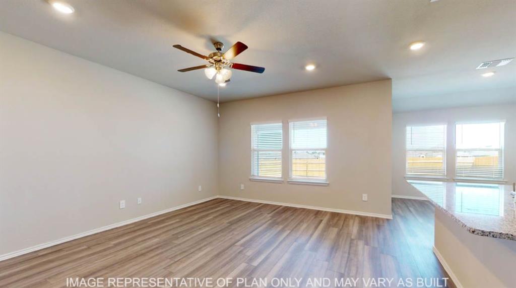 10325 Altair Drive Waco, TX 76708 - Photo 7 of 15 an empty room with wooden floor and windows