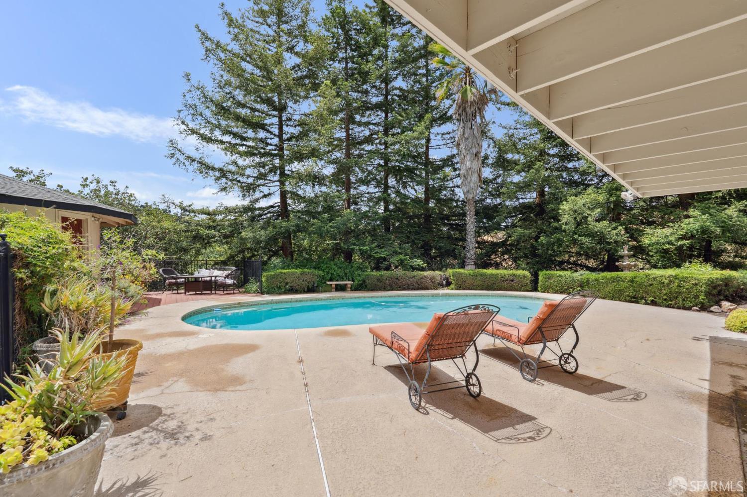 375 Montecillo Drive Walnut Creek, CA 94595 - Photo 51 of 79 a view of a patio with a table and chairs under an umbrella