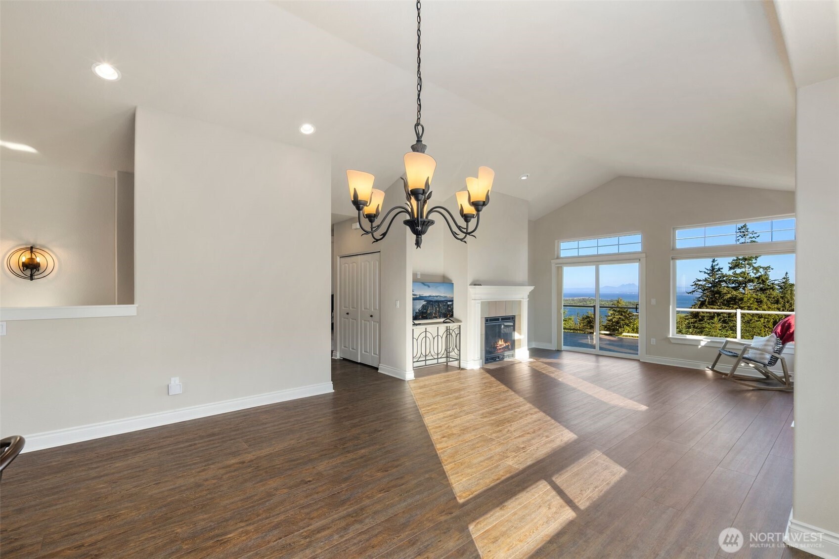 3224 Overlook Loop Ilwaco, WA 98624 - Photo 6 of 38 a view of a living room and dining room with wooden floor