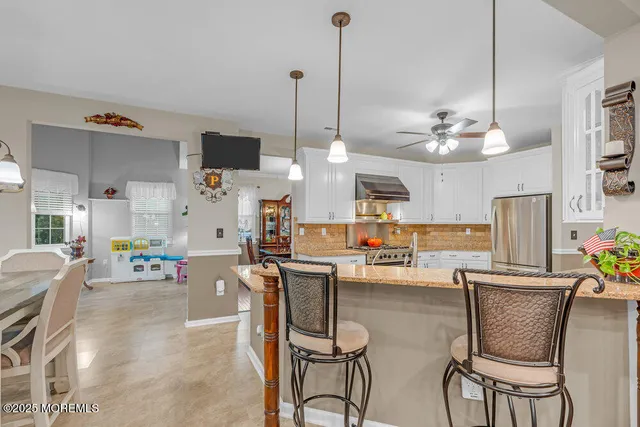 a bedroom with furniture and a window