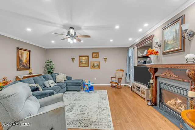 a living room with furniture and a chandelier