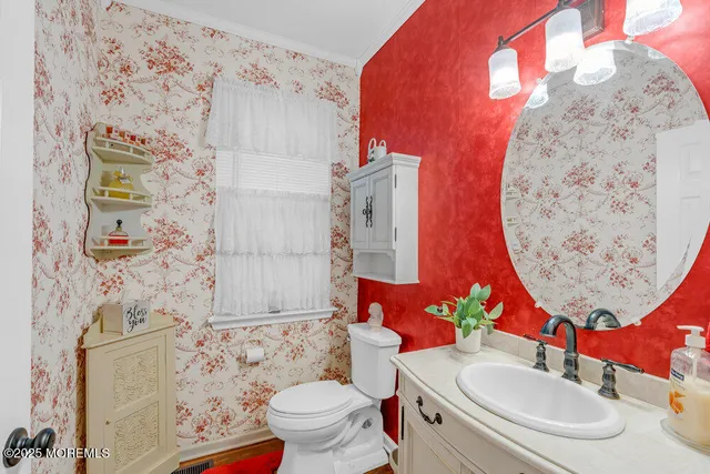a bathroom with a granite countertop double vanity sinks and a mirror