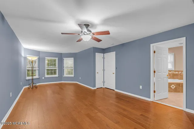 a bathroom with a granite countertop sink and a bathtub