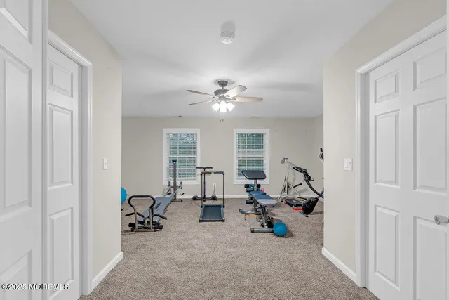 a bathroom with a granite countertop sink toilet a mirror and shower