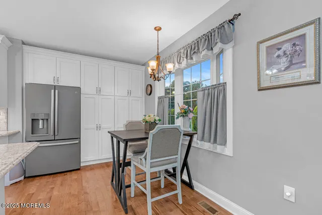 a view of a house with a deck and a patio