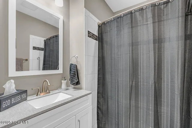 a view of patio with table and chairs under an umbrella