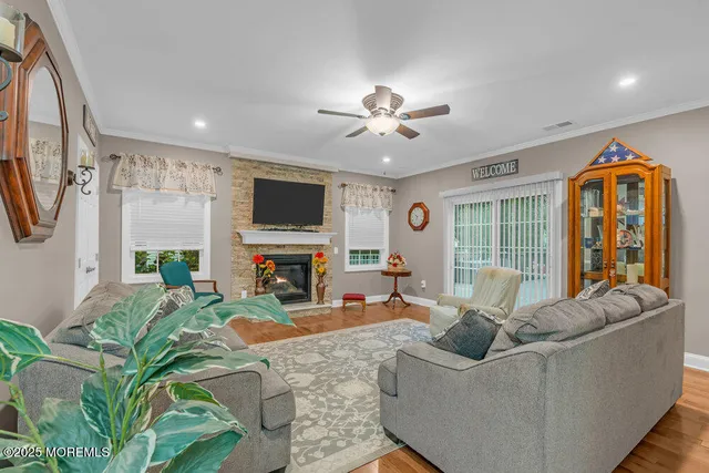 a view of a house with a backyard and a tree