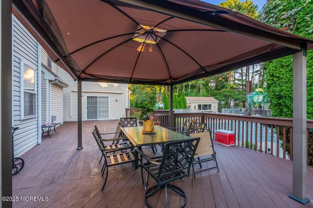 a view of a house with a yard and a garden