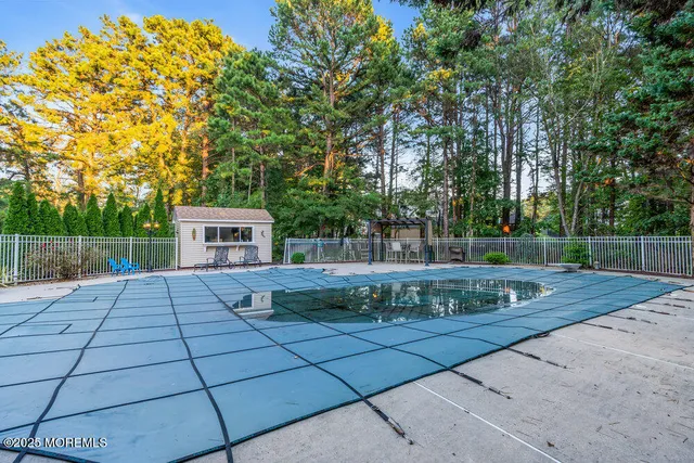 an aerial view of a house with garden space and street view