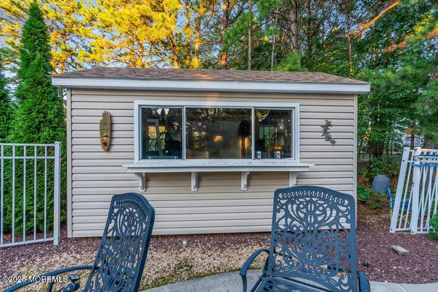 an aerial view of a house with a yard and balcony