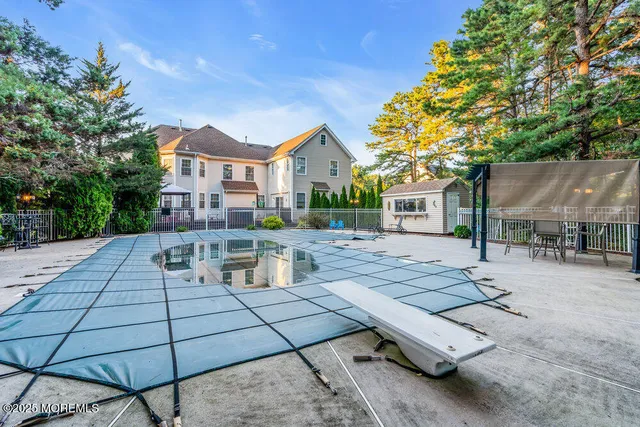 an aerial view of a house with garden space and street view