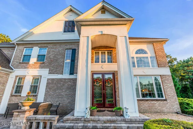 front view of a brick house with a outdoor space