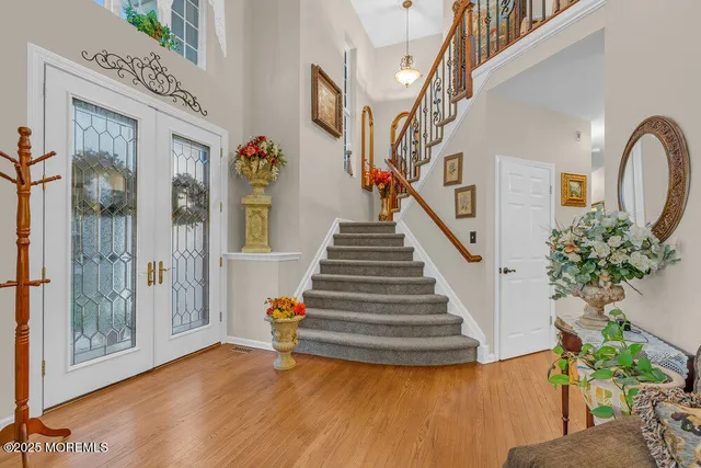 a living room with furniture and a chandelier