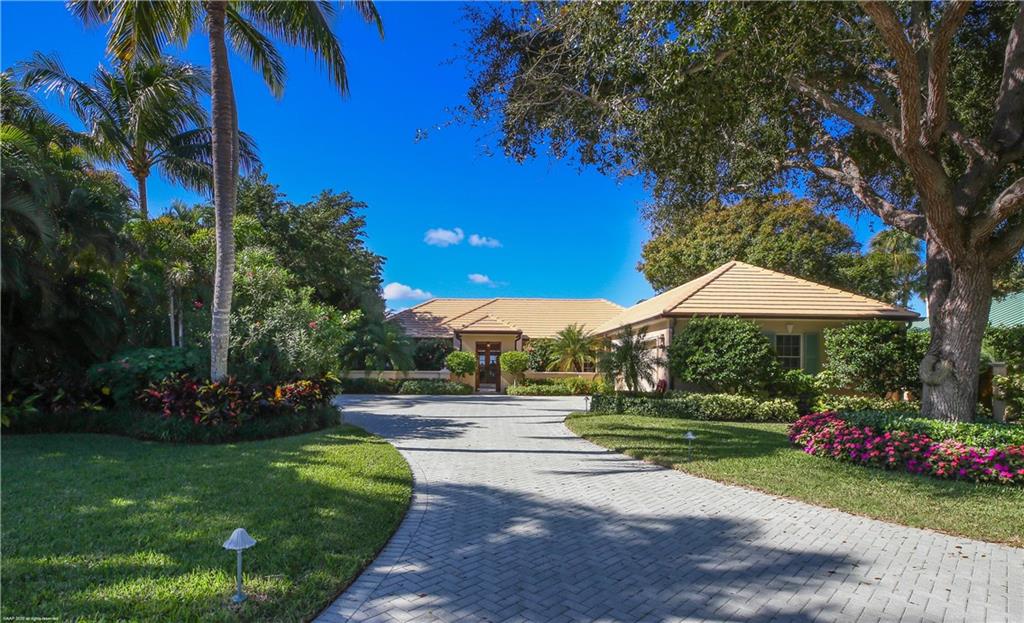 37 West High Point Road Stuart, FL 34996 - Photo 1 of 35 a view of a garden with potted plants