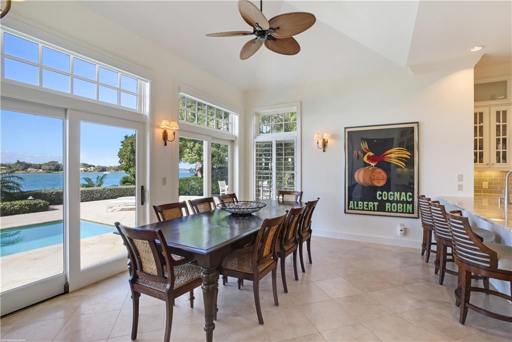 37 West High Point Road Stuart, FL 34996 - Photo 14 of 35 a view of a dining room with furniture window and outside view