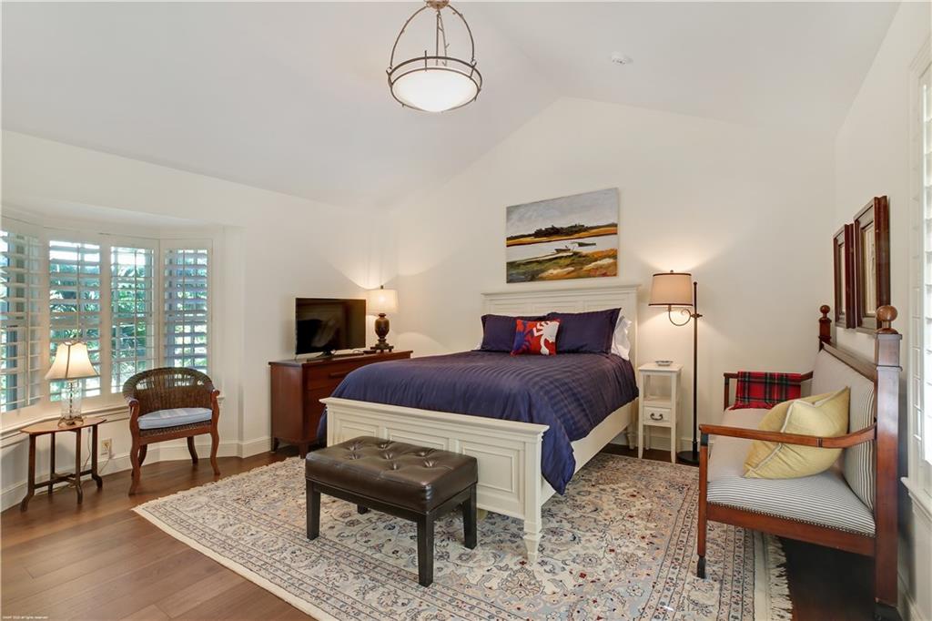 37 West High Point Road Stuart, FL 34996 - Photo 22 of 35 a bedroom with furniture and a flat screen tv