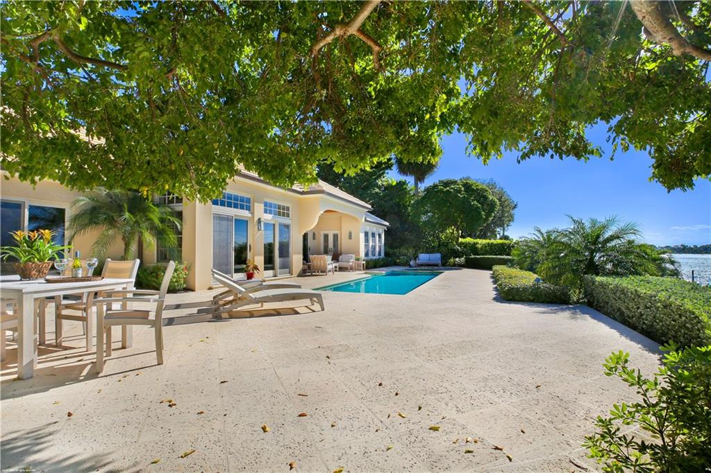 37 West High Point Road Stuart, FL 34996 - Photo 27 of 35 a view of a house with backyard and sitting area