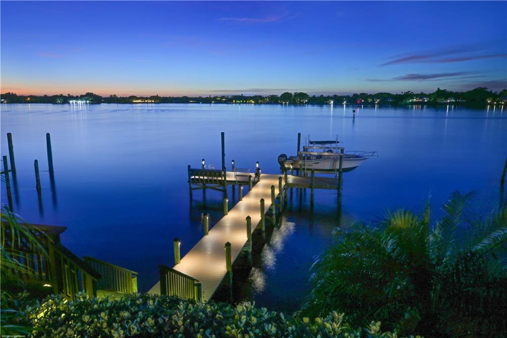 37 West High Point Road Stuart, FL 34996 - Photo 35 of 35 a view of a lake with sitting area and lake view