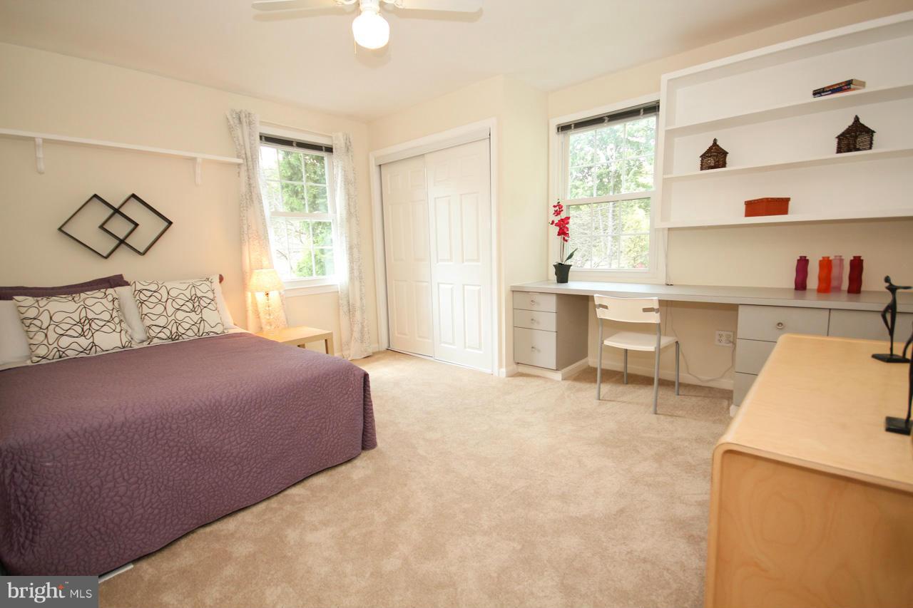 14305 Piccadilly Road Silver Spring, MD 20906 - Photo 18 of 30 a bedroom with a bed and a cabinets